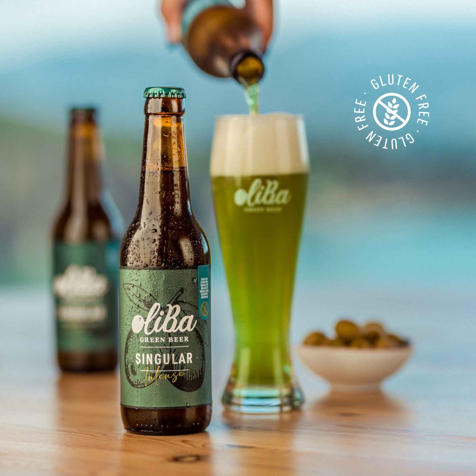 Oliba Green Beer | SINGULAR 5,5% | The first green beer in the world with olives. Gluten free, craft in the Bohemian Pilsner style with 100% natural ingredients.